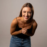 Thumbnail for Smiling woman in casual attire, showcasing joy and happiness, ideal for lifestyle and fashion content.