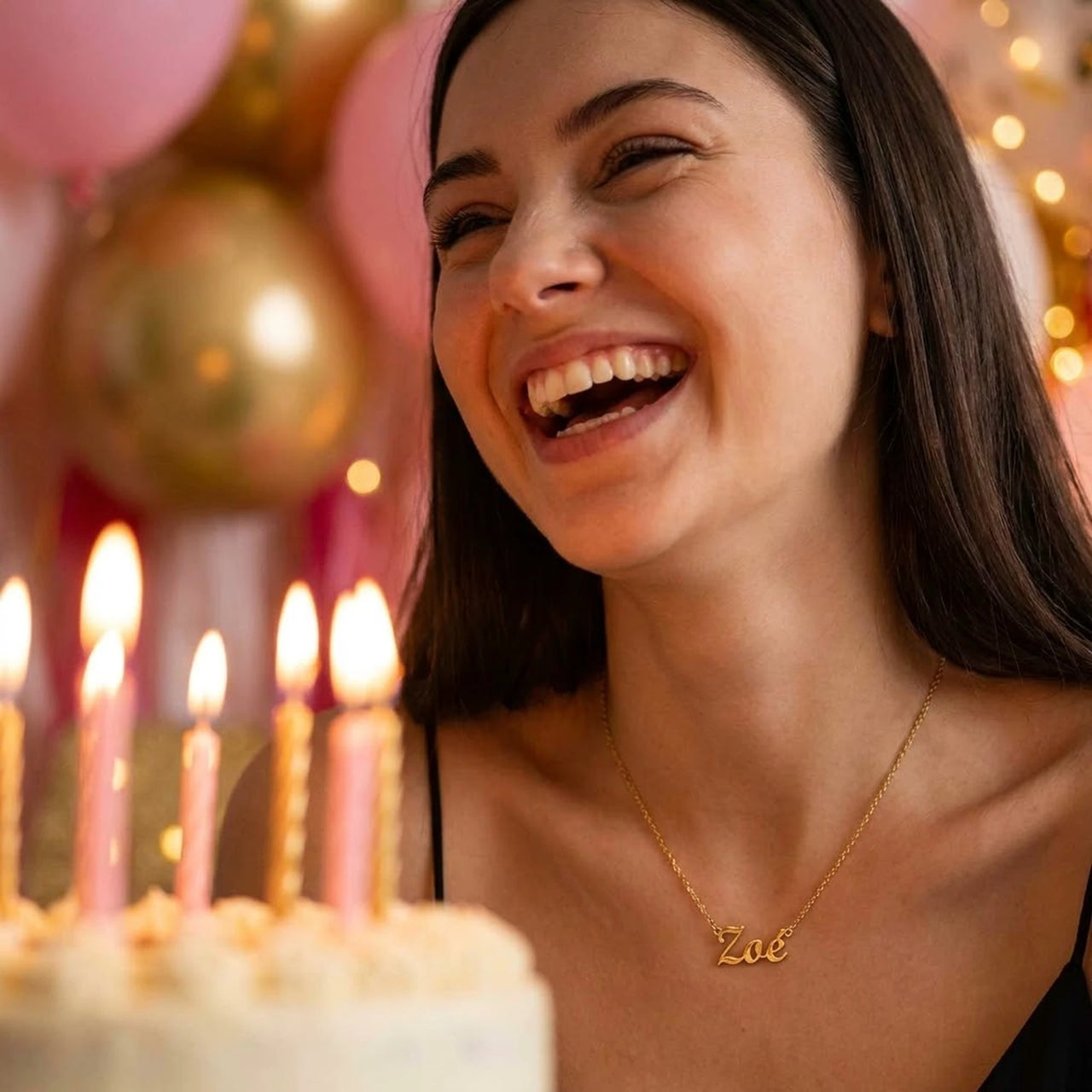 Minimalist Name Necklace in gold worn at a birthday celebration, the name Zoe engraved in cursive script | SKU: minimalistnn-gold