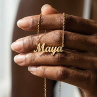 Thumbnail for Minimalist Name Necklace pendant resting on a hand for scale, the name Maya | SKU: minimalistnn-gold