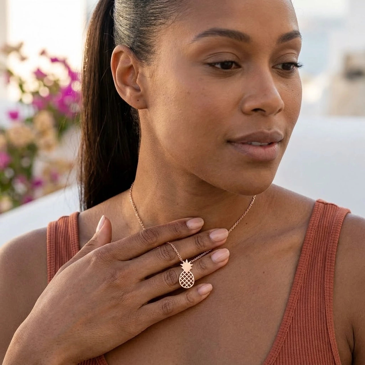 Woman gently touching her rose gold necklace | SKU: 8050907-rose-gold