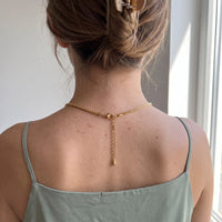 Thumbnail for Back of the neck showing the lobster clasp and extension chain of the gold heart photo necklace | SKU: TPH-CHTN-GOLD-SMALL
