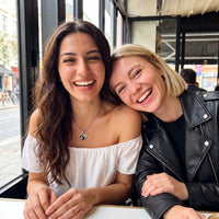 Thumbnail for Two best friends laughing together, one wearing the silver secret heart photo necklace | SKU: TPH-CHTN-SILVER-SMALL