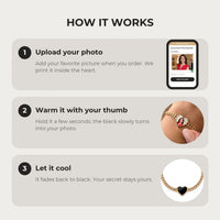Thumbnail for How it works: upload your photo, warm the heart charm with your thumb, let it cool back to black | SKU: TPH-HRTB-GOLD