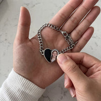 Thumbnail for Thumb warming the silver heart bracelet plate: the hidden photo appears under the thumb while the rest stays black | SKU: TPH-HRTB-SILVER